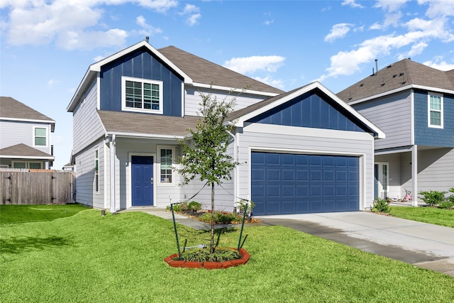 view of front of home featuring a front yard and a garage