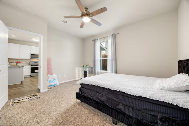 22107 King Heights Ln, Houston, TX 77073 - bedroom with light colored carpet, baseboards, a ceiling fan, and visible vents