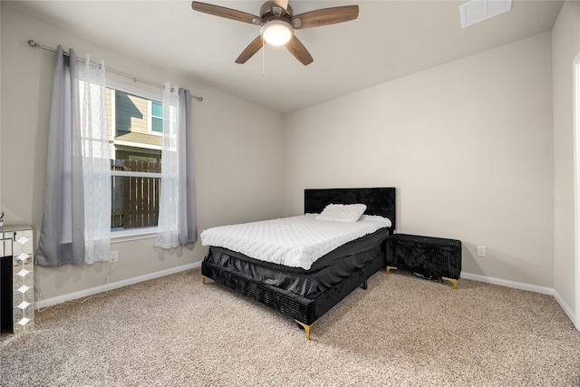 bedroom with ceiling fan and carpet