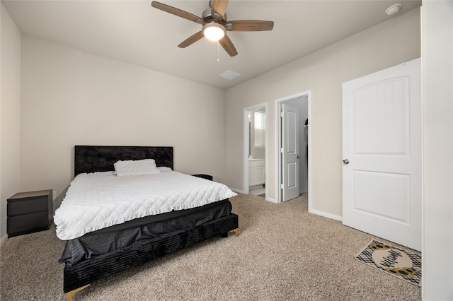 bedroom with connected bathroom, carpet flooring, and ceiling fan