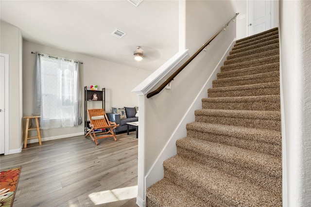 22107 King Heights Ln, Houston, TX 77073 - stairway with wood finished floors, baseboards, a ceiling fan, and visible vents