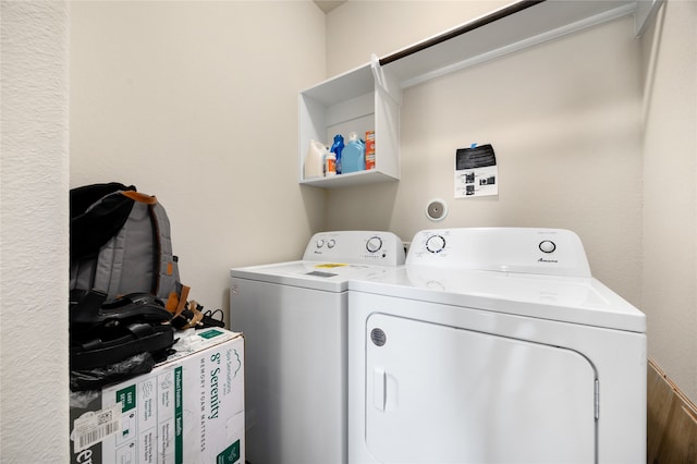 laundry room with independent washer and dryer