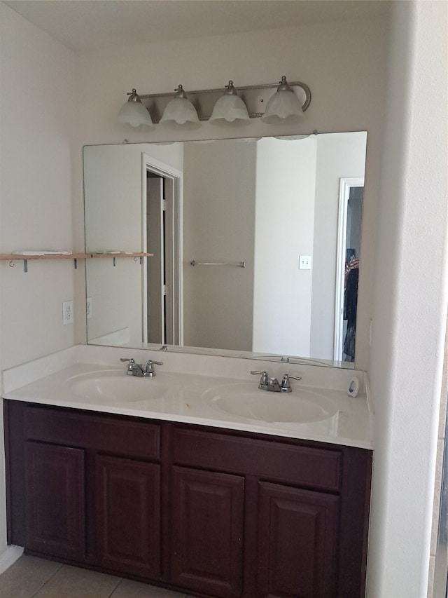 bathroom featuring tile patterned flooring and vanity