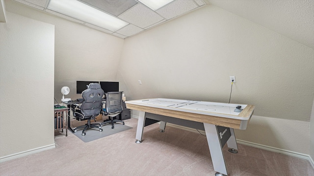 office area with carpet floors and vaulted ceiling