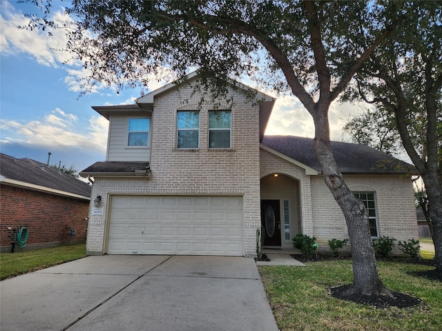 view of front property with a front lawn and a garage