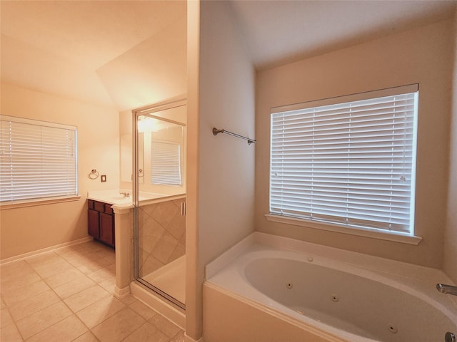 bathroom with tile patterned floors, vanity, and independent shower and bath