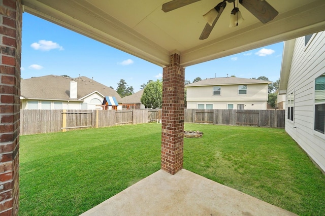 view of yard with ceiling fan and a patio area