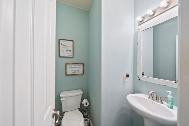 bathroom with sink and toilet