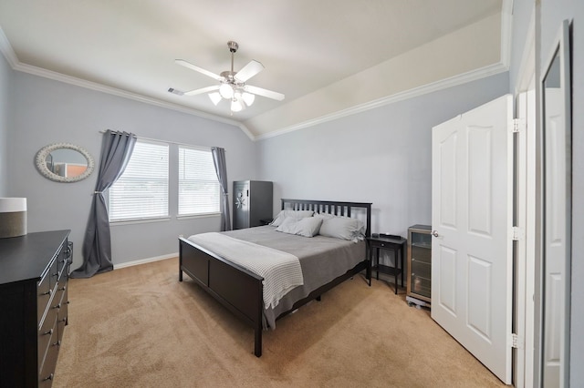 bedroom with crown molding, lofted ceiling, light carpet, and ceiling fan