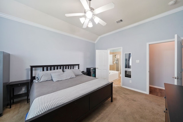 carpeted bedroom with connected bathroom, lofted ceiling, crown molding, and ceiling fan