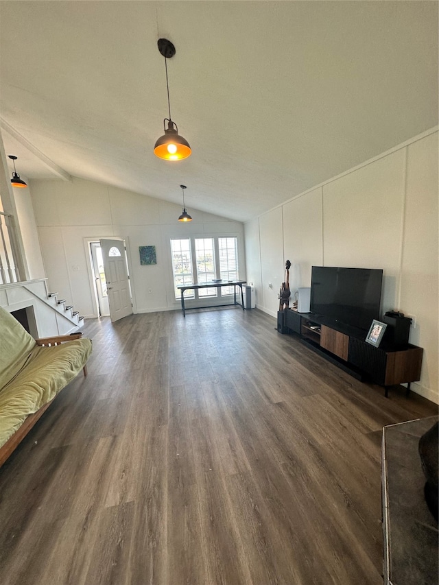 unfurnished living room featuring dark wood-type flooring and vaulted ceiling