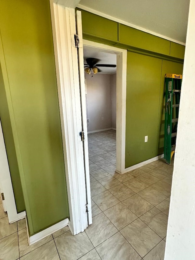 hall featuring light tile patterned floors