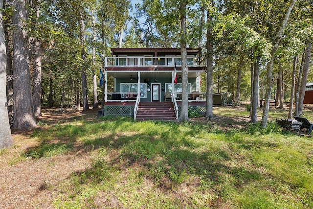 back of house featuring a wooden deck