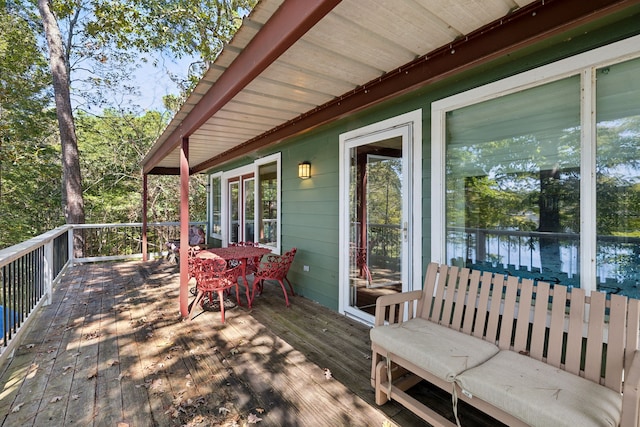 wooden terrace with a water view