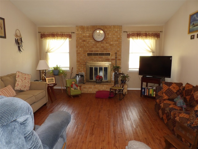 living room with a fireplace and hardwood / wood-style flooring