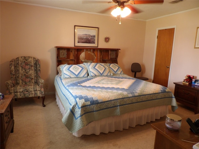 bedroom featuring ceiling fan, light colored carpet, and crown molding