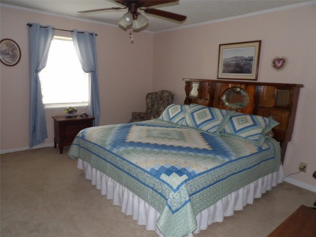 bedroom with ornamental molding, ceiling fan, and carpet flooring