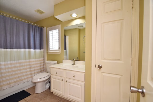 bathroom with vanity, tile patterned flooring, toilet, and curtained shower