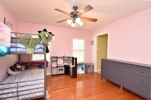 bedroom with light wood-type flooring and ceiling fan