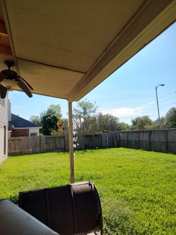 view of yard featuring ceiling fan
