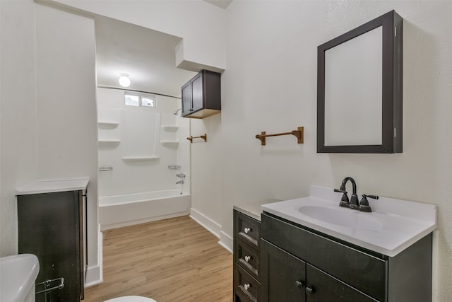 full bathroom with wood-type flooring, shower / tub combination, vanity, and toilet