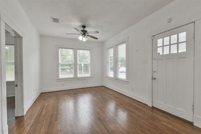 foyer featuring ceiling fan and dark wood-type flooring