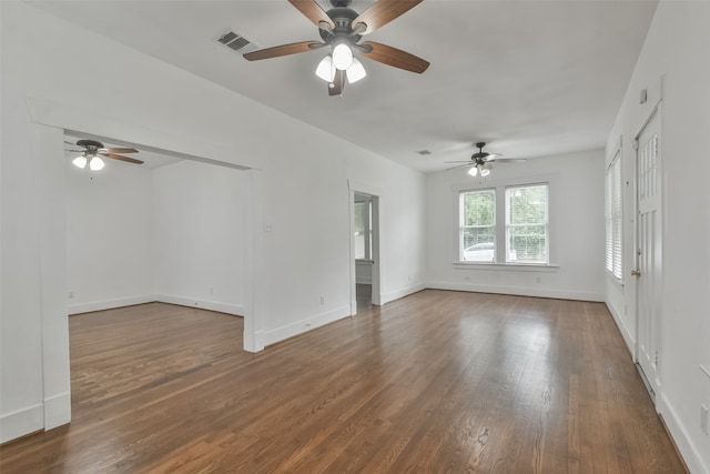 empty room featuring ceiling fan and dark hardwood / wood-style flooring