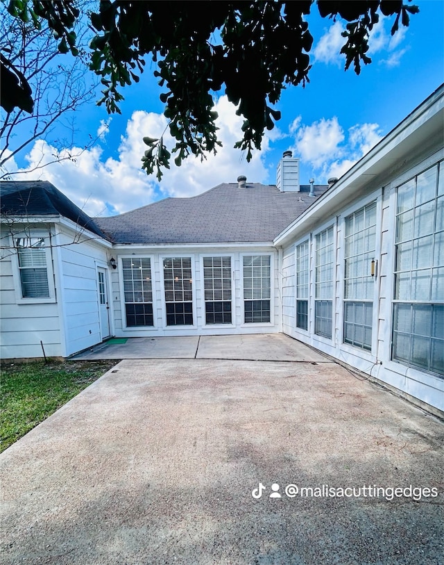 back of house with a patio area