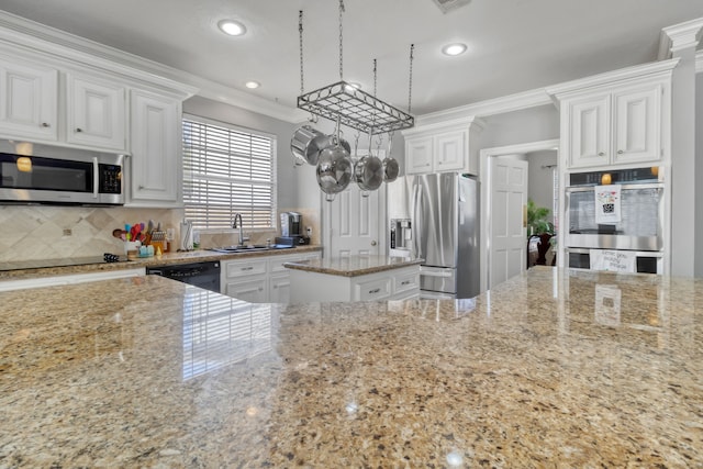 18106 Briden Oak Ct, Spring, TX 77379 - kitchen with black appliances, a sink, light stone counters, crown molding, and backsplash