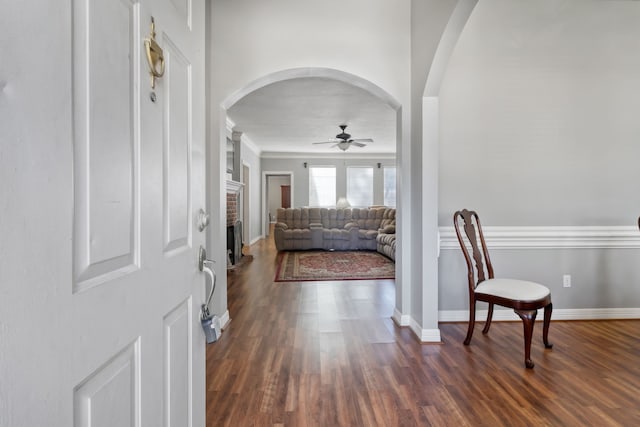 18106 Briden Oak Ct, Spring, TX 77379 - entrance foyer with a ceiling fan, arched walkways, dark wood-type flooring, ornamental molding, and baseboards