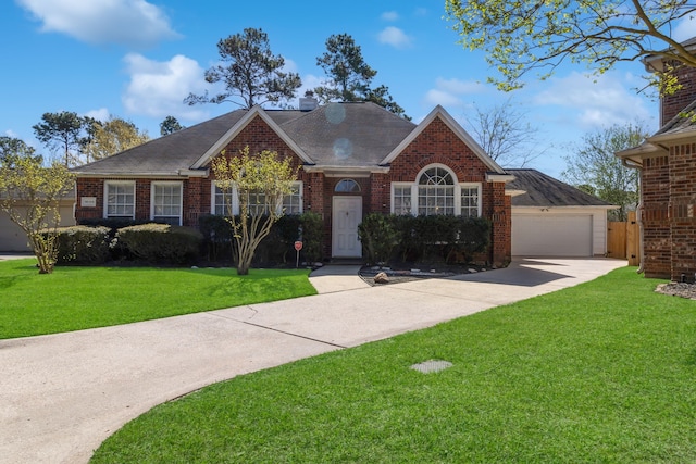 18106 Briden Oak Ct, Spring, TX 77379 - view of front of house featuring brick siding, a front yard, and roof with shingles