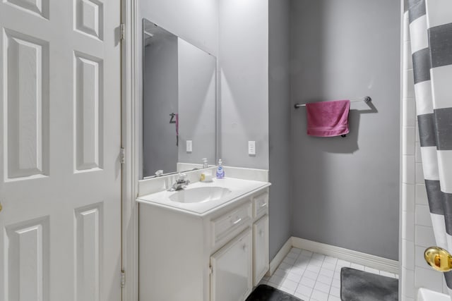 18106 Briden Oak Ct, Spring, TX 77379 - bathroom with vanity, a shower with shower curtain, baseboards, and tile patterned floors