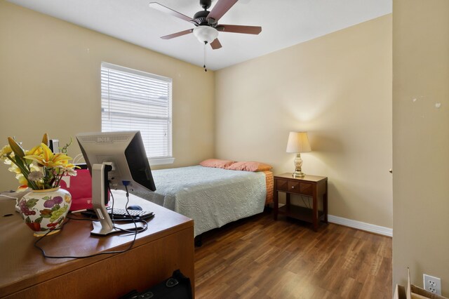 18106 Briden Oak Ct, Spring, TX 77379 - bedroom with wood finished floors, baseboards, and a ceiling fan
