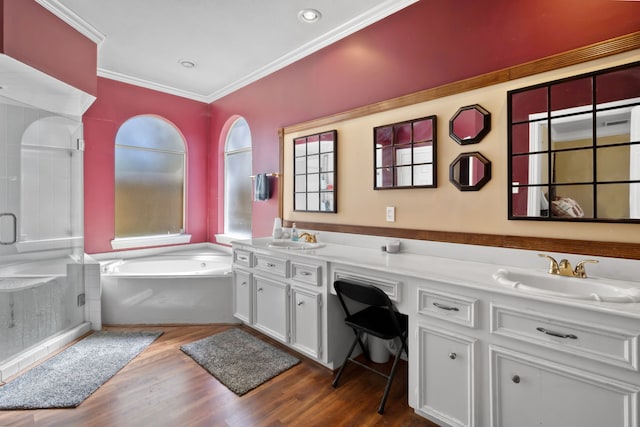18106 Briden Oak Ct, Spring, TX 77379 - full bath featuring a stall shower, double vanity, crown molding, a garden tub, and wood finished floors
