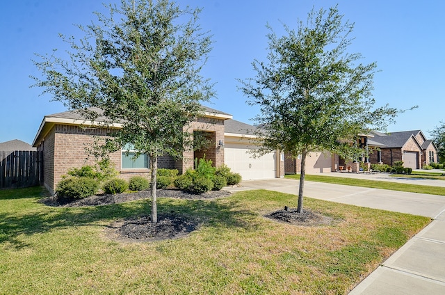 obstructed view of property with a front yard and a garage