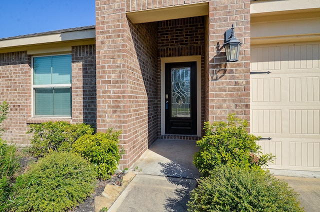 doorway to property featuring a garage