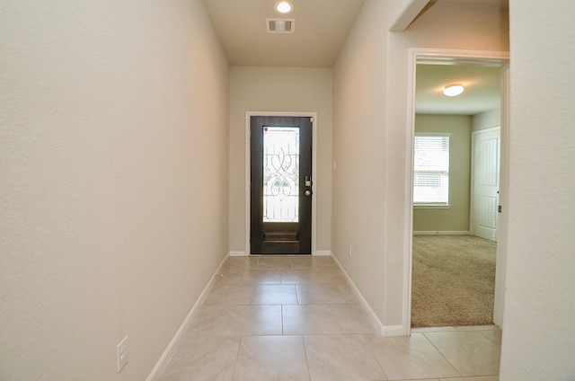 entrance foyer with light carpet