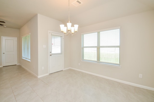 interior space with ceiling fan with notable chandelier and light tile patterned flooring