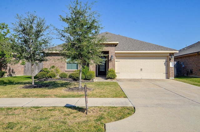 view of front facade featuring a garage and a front lawn