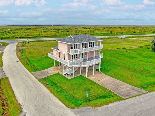 birds eye view of property with a rural view