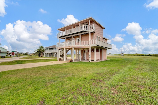 back of property with a lawn