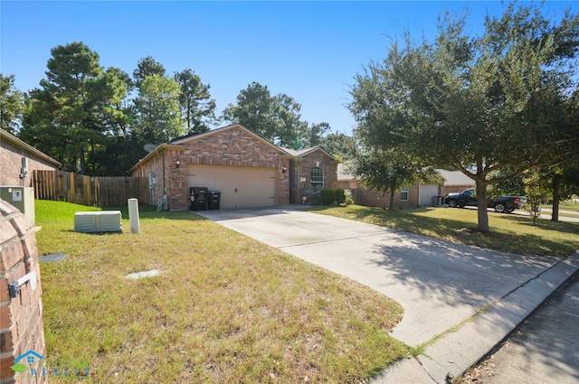 ranch-style home with a front yard, cooling unit, and a garage