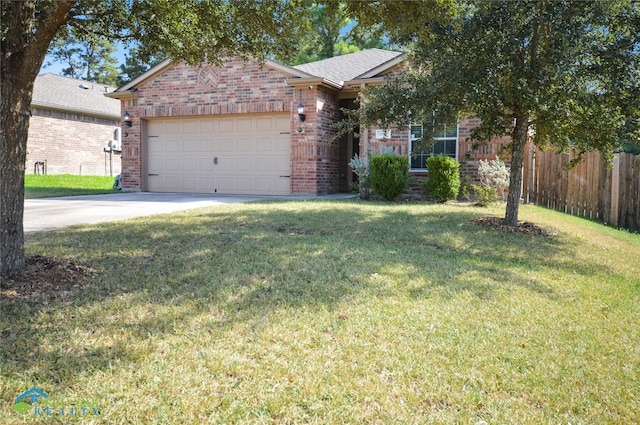 view of front of home with a garage and a front yard