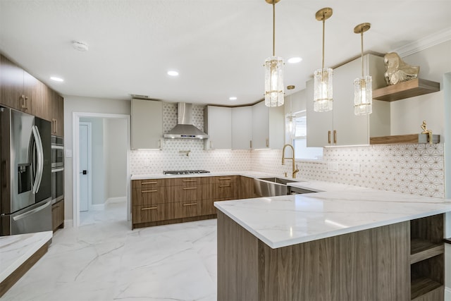 kitchen with white cabinets, sink, kitchen peninsula, wall chimney exhaust hood, and stainless steel appliances