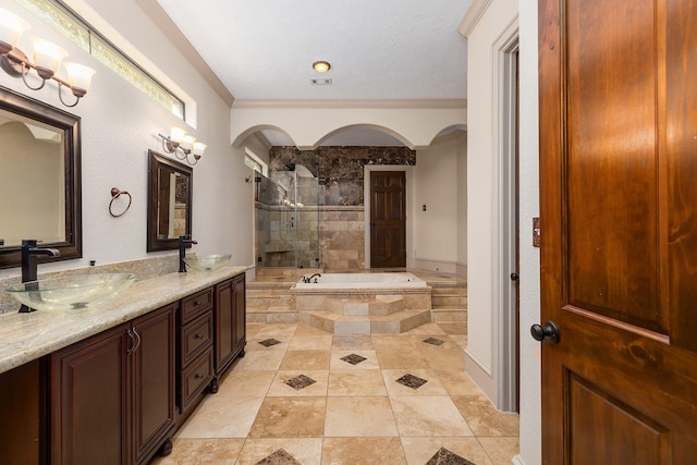 bathroom with vanity, ornamental molding, and shower with separate bathtub