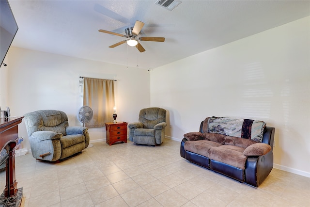 living room with ceiling fan and light tile patterned floors