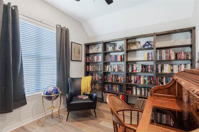 sitting room with ceiling fan, lofted ceiling, and light hardwood / wood-style floors