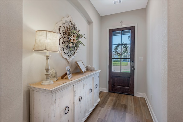 doorway to outside with light hardwood / wood-style floors