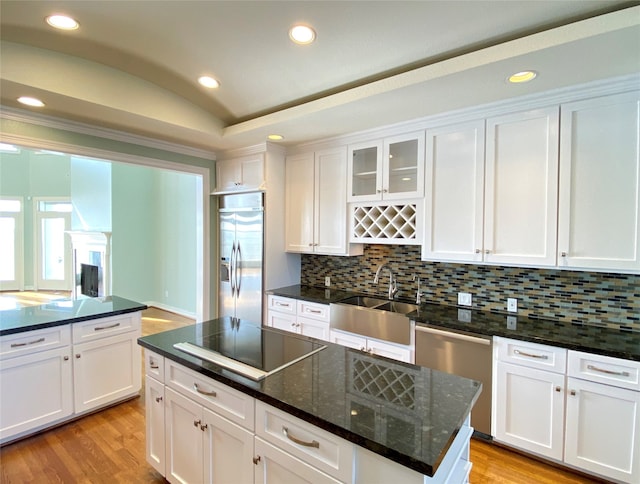 kitchen with white cabinetry, appliances with stainless steel finishes, and sink