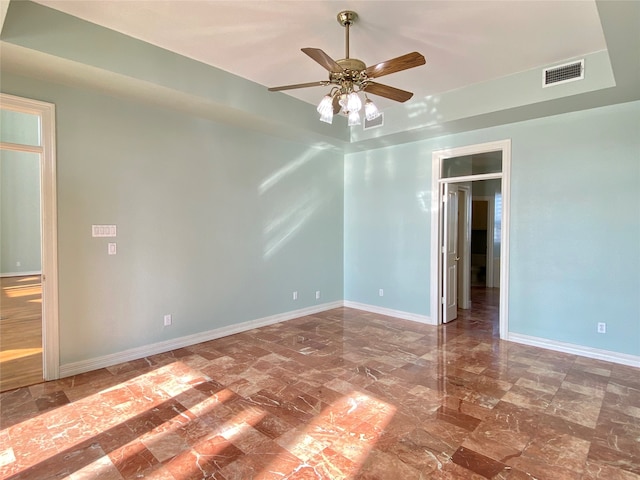 spare room with ceiling fan